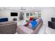 Bright living room with tile floors, large bay window, and modern furnishings at 1206 Culver Rd, Orlando, FL 32825