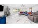 Bright living room boasts marble floors, bay windows, and a cozy atmosphere with a Christmas tree at 1206 Culver Rd, Orlando, FL 32825