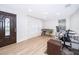 Inviting entryway featuring a modern door, light wood flooring, and a bright, open living space at 1206 Culver Rd, Orlando, FL 32825