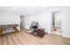 Bright office space with wood floors, desk, foosball table, and updated bathroom at 1206 Culver Rd, Orlando, FL 32825