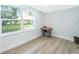 A bright room with wood-look flooring, a large window, and natural light at 1206 Culver Rd, Orlando, FL 32825