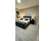 Cozy bedroom featuring a bed with decorative pillows, bedside tables, and neutral decor at 1526 Hempel Ave, Gotha, FL 34734