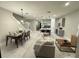 Bright, open-concept living space with dining area, modern kitchen and comfortable seating at 1526 Hempel Ave, Gotha, FL 34734