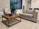 Comfortable living area with a modern coffee table, plush seating, and stylish rug at 1526 Hempel Ave, Gotha, FL 34734