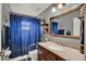 This bathroom includes vanity with granite countertops and an framed mirror at 1709 Kinsman Way, Lakeland, FL 33809