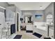 This bathroom features a separate tub, shower, dual vanity, and beach themed decorations at 1709 Kinsman Way, Lakeland, FL 33809