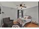 This is a cozy bedroom with a ceiling fan, and a warm color pallette at 1709 Kinsman Way, Lakeland, FL 33809