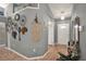 Inviting foyer with tile flooring and decorative wall accents create a warm and welcoming entrance at 1709 Kinsman Way, Lakeland, FL 33809