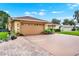 This beautiful home includes a two-car garage and brick paver driveway, adding character and value at 1709 Kinsman Way, Lakeland, FL 33809