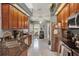 Bright and open kitchen featuring stainless steel appliances, ample cabinet space, and a functional layout at 1709 Kinsman Way, Lakeland, FL 33809