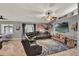 Comfortable living room with large sectional sofa, media center, and decor at 1709 Kinsman Way, Lakeland, FL 33809