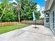 Landscaped backyard featuring a well-maintained lawn and a stone patio at 1712 Riveredge Rd, Oviedo, FL 32766