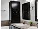The bathroom features double sinks, a vanity with storage, modern fixtures, and a tub at 1712 Riveredge Rd, Oviedo, FL 32766