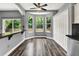 Bright breakfast nook featuring large windows, a ceiling fan, and seamless flow into the kitchen space at 1712 Riveredge Rd, Oviedo, FL 32766