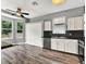 Bright breakfast nook with large windows, a ceiling fan, and stylish flooring adjacent to the kitchen at 1712 Riveredge Rd, Oviedo, FL 32766