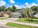 Charming single-story home with a well-manicured lawn and mature palm tree in a desirable neighborhood at 1712 Riveredge Rd, Oviedo, FL 32766