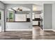 An open-concept kitchen featuring modern appliances, dark backsplash, and seamless flow into the breakfast nook at 1712 Riveredge Rd, Oviedo, FL 32766