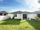 A well-maintained backyard and a patio at 17504 Butterfly Pea Ct, Clermont, FL 34714