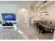 Open-concept living and dining room with tile floors and modern decor at 17504 Butterfly Pea Ct, Clermont, FL 34714
