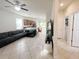 Spacious living room opens to the kitchen with tile floors, great for entertaining at 17504 Butterfly Pea Ct, Clermont, FL 34714