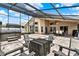 Beautiful backyard with a screened-in patio, outdoor seating, and a hot tub at 211 Tavestock Loop, Winter Springs, FL 32708