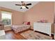 Charming bedroom with wood floors, vaulted ceilings, and natural light from the window at 211 Tavestock Loop, Winter Springs, FL 32708