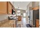 Modern kitchen with granite countertops, stainless steel appliances, and ample cabinet space at 211 Tavestock Loop, Winter Springs, FL 32708