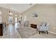 Inviting living room with tile flooring, a neutral color palette, and ample natural light at 211 Tavestock Loop, Winter Springs, FL 32708