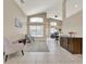 Bright and airy living room with vaulted ceilings and neutral tones at 211 Tavestock Loop, Winter Springs, FL 32708