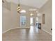 Open living area with large windows, high ceilings, and modern lighting fixtures at 211 Tavestock Loop, Winter Springs, FL 32708