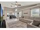 Spacious open-plan living room and dining area with lots of natural light at 211 Tavestock Loop, Winter Springs, FL 32708