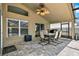 Covered patio with a ceiling fan and a dining table with chairs at 211 Tavestock Loop, Winter Springs, FL 32708