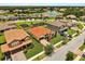Beautiful aerial view showing neighborhood with a playground and pond nearby at 212 Lugano Way, Debary, FL 32713