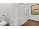 Modern bathroom featuring a soaking tub, glass shower, and marble-look tile at 212 Lugano Way, Debary, FL 32713