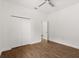 Bedroom with wood-look floors features a closet and doorway at 212 Lugano Way, Debary, FL 32713