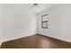 Bright bedroom with wood-look floors features a ceiling fan and window at 212 Lugano Way, Debary, FL 32713