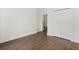 Bedroom with wood-look floors features closet and trim throughout at 212 Lugano Way, Debary, FL 32713