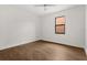 Bedroom with wood-look tile flooring, ceiling fan, and window with natural light at 212 Lugano Way, Debary, FL 32713