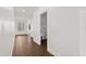 Hallway with wood-look floors leads to the home's bedrooms at 212 Lugano Way, Debary, FL 32713
