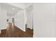 Bright hallway features wood-look floors, trim, and doors to other rooms at 212 Lugano Way, Debary, FL 32713