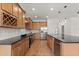 Bright modern kitchen featuring black countertops, stainless steel appliances, and plenty of counter space at 212 Lugano Way, Debary, FL 32713