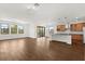 Open floor plan boasting tile floors, multiple windows, and seamless access to kitchen at 212 Lugano Way, Debary, FL 32713