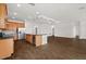 Open-concept living space with hardwood floors and a large kitchen island at 212 Lugano Way, Debary, FL 32713