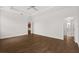 Large main bedroom featuring wood-look tile flooring and ensuite bathroom at 212 Lugano Way, Debary, FL 32713