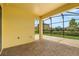 Covered outdoor patio features brick flooring, ceiling and screened in enclosure at 212 Lugano Way, Debary, FL 32713
