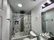Updated bathroom with a marble-tiled shower, modern fixtures, and ample counter space at 223 Hope Cir, Orlando, FL 32811