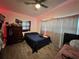 Cozy bedroom with wood floors and a ceiling fan, providing a relaxing and comfortable atmosphere at 223 Hope Cir, Orlando, FL 32811