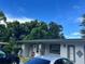 Charming single-story home with a well-kept lawn and multiple vehicles parked in front at 223 Hope Cir, Orlando, FL 32811