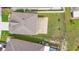 Aerial view of house with covered patio and fenced backyard at 2254 Canyon Breeze Ave, Kissimmee, FL 34746