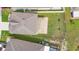 Aerial view of house with covered patio and fenced backyard at 2254 Canyon Breeze Ave, Kissimmee, FL 34746